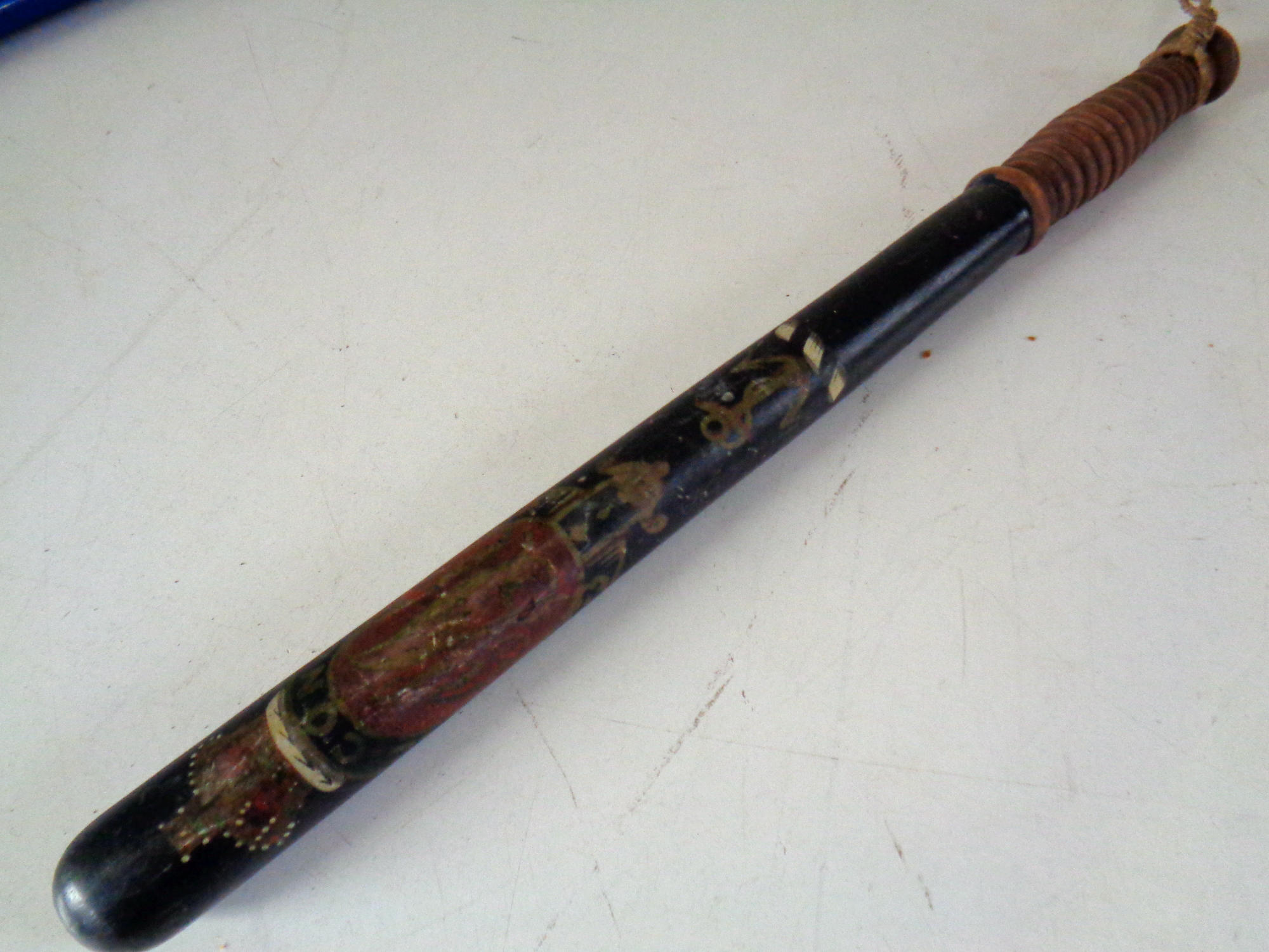 A turned wooden police truncheon with later decoration