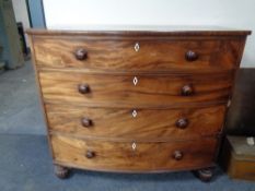 A Victorian mahogany bow fronted four drawer chest.