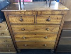 A 19th century pine five drawer chest