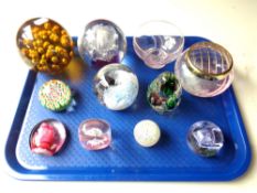 A tray of nine glass paperweights including Caithness,