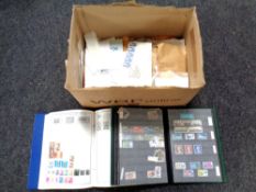A box of files and albums of world stamps,