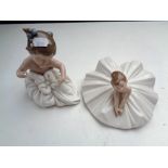 A Nao figure of a ballerina and further figure of a baby in dress