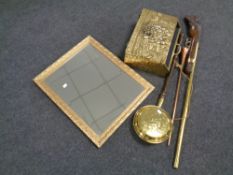 A gilt framed mirror together with a brass magazine rack, replica rifle, bed warming pan,