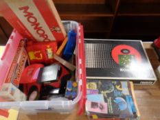 A crate of assorted board games, card games, counters, Uno,