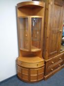 A twentieth century antique Nathan double-door glazed corner cabinet fitted with cupboards and