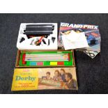 A Scalextric Grand prix racing set together with a Merit Derby horse racing game