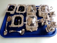 A tray of silver plated wares, castors, straining spoon, mustard pots,