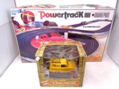 A Matchbox Powertrack 1000 Grand Prix together with an Only Fools and Horses 3d talking alarm clock