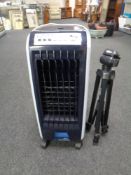 An air-conditioning unit together with a camera tripod.