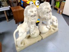 A pair of plastic lion garden figures,