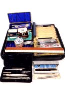 A tray of rulers, hip flask, Colibri lighter, boxed cutlery,