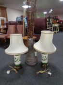 A pair of brass and ceramic table lamps with shades together with a floor-standing vase containing