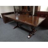 A Jaycee furniture carved oak refectory dining table with set of eight chairs in studded leather