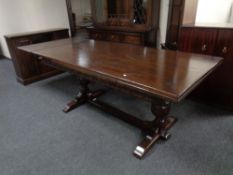 A Jaycee furniture carved oak refectory dining table with set of eight chairs in studded leather