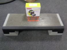A Reebok fitness step together with a pair of boxed York fitness push-up stands.