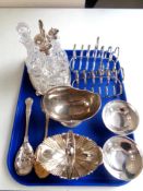 A tray of silver plated wares to include cruet set on stand, berry spoons, swing handled bowls,