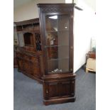 A Jaycee furniture carved oak corner unit