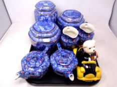 A tray of Ringtons blue and white caddies, chintz tea china,