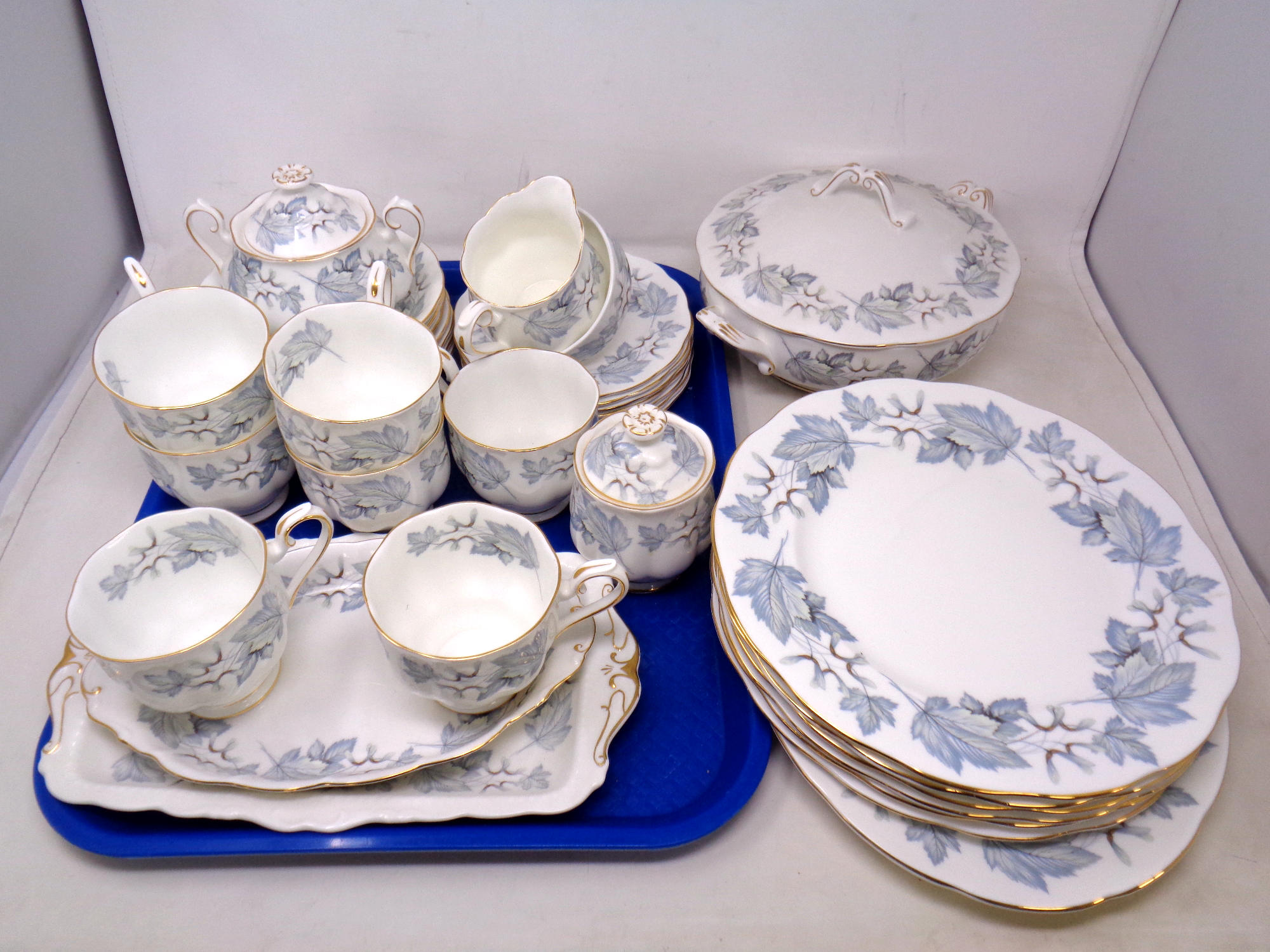 Thirty-five pieces of Royal Albert Silver Maple bone china tea and dinner ware.