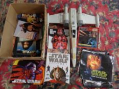 A box of Star Wars memorabilia including Episode I school pack, books,