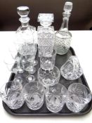 A tray of three cut glass decanters, set of four whisky tumblers,