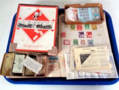 A tray of vintage monopoly set, train ticket stubs,