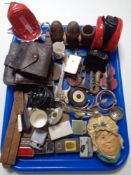 A tray of leather purses, folding wooden rule, matchbox holder, lighters, treen cruet set,