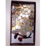 A tray of pre decimal and European coins together with two miniature pipes