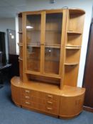 A 20th century teak G-plan glazed double door bookcase together with matching pair of corner
