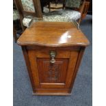 A 19th century carved oak fall fronted coal receiver with liner and brass fittings