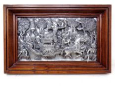 A decorative silvered Thai plaque in wooden frame