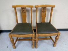 A pair of early 20th century carved oak dining chairs