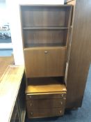 A mid century teak bureau bookcase fitted with three drawers