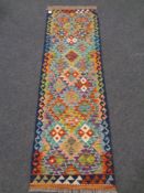 A Chobi kilim runner 194cm by 62cm