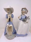 Two Nao figures of a girl with parasol and girl seated with bonnet