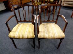 A pair of Regency style mahogany armchairs