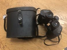 A pair of Yashica 10 X 50 binoculars, model Y-No. 77786, in black carry case.