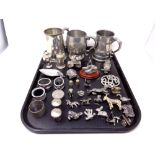 A tray of stainless steel tankards, animal ornaments, pair of sifters,