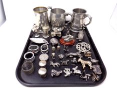 A tray of stainless steel tankards, animal ornaments, pair of sifters,