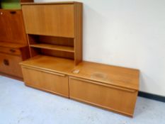 A mid century teak fall fronted bureau together with further matching cupboard