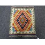 A Chobi kilim 55cm by 47cm