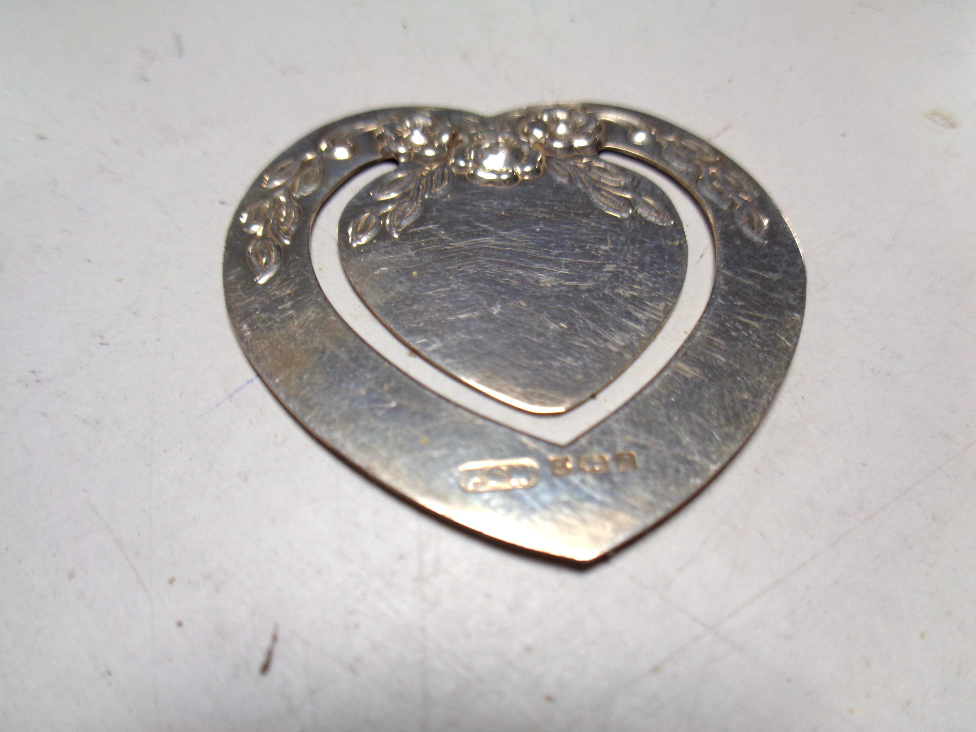 A silver cigarette case with engine turned decoration together with a silver heart shaped bookmark - Image 2 of 2