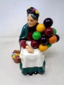 A Royal Doulton figure HN 1315 The Old Balloon Seller
