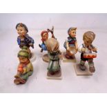 A group of six West German Goebel figures of children