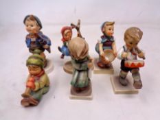 A group of six West German Goebel figures of children