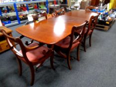 A Regency style mahogany twin pedestal dining table with leaf together with six chairs