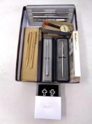 A box of Sheaffer pens, further pens including Parker, pocket compass/map measurer,