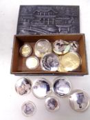 A Japanese embossed metal cigarette box containing a quantity of John Wayne commemorative coins