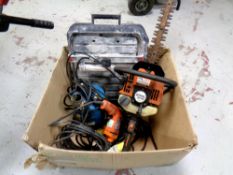 A box of Stihl HS80 hedge trimmer, drill,