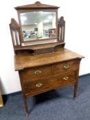 An oak Art Nouveau three drawer dressing chest